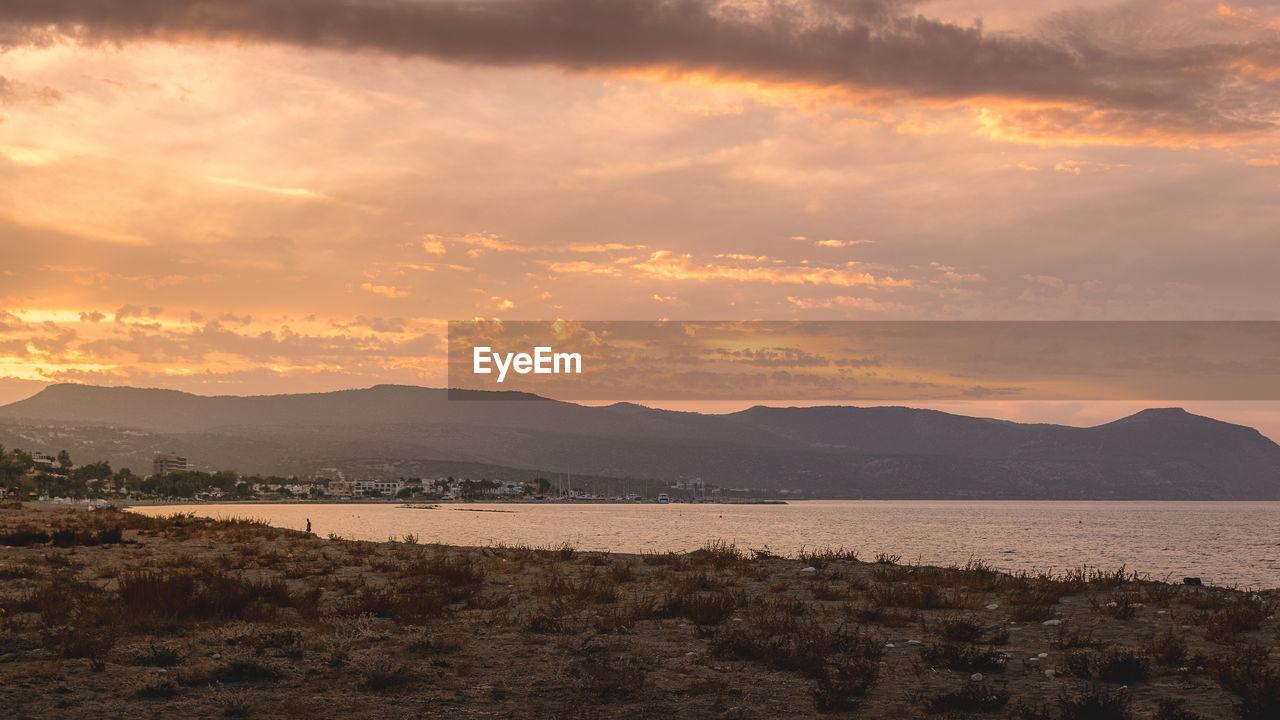 Scenic view of mountains against sky during sunset