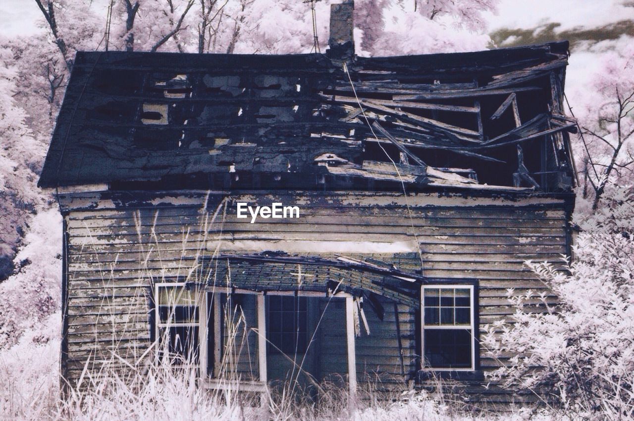 Abandoned house on field