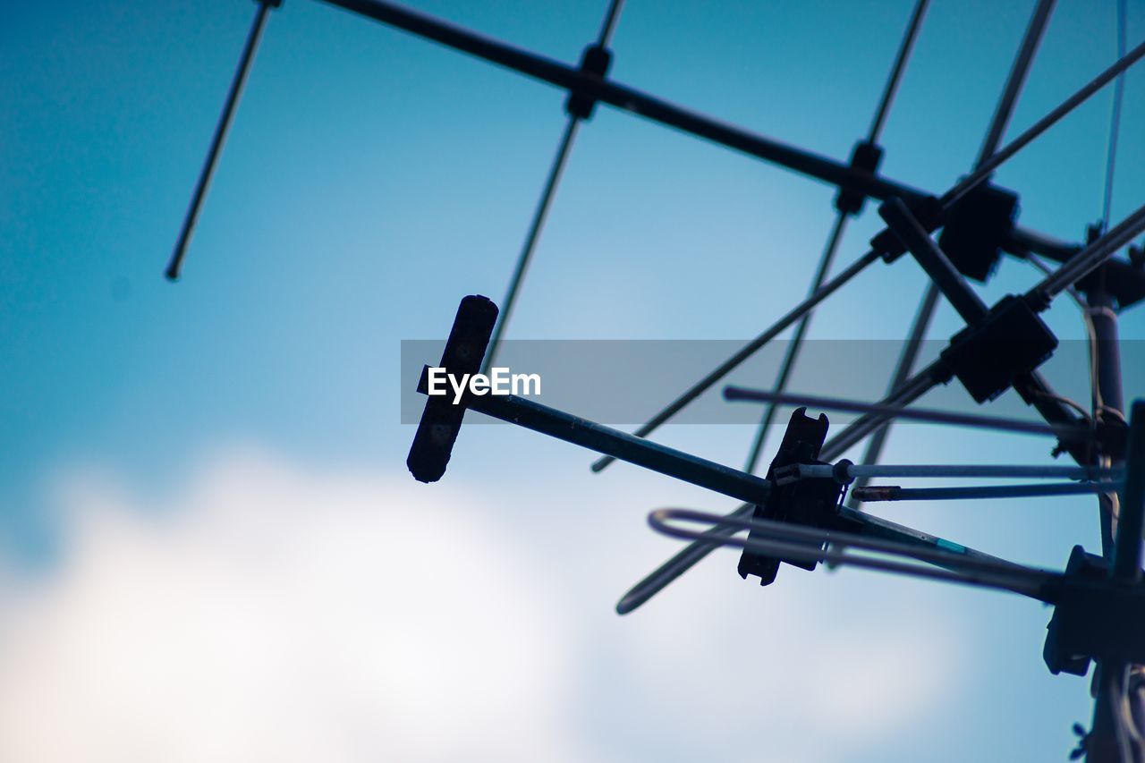 Low angle view of antenna against sky