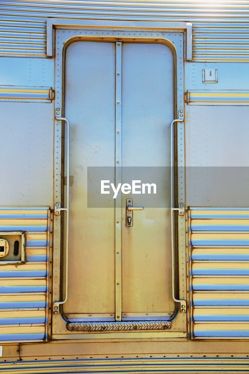 Closed metallic door of train