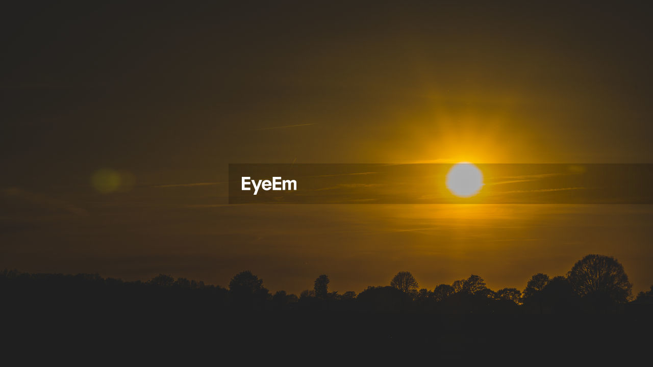 Scenic view of silhouette landscape against sky during sunset