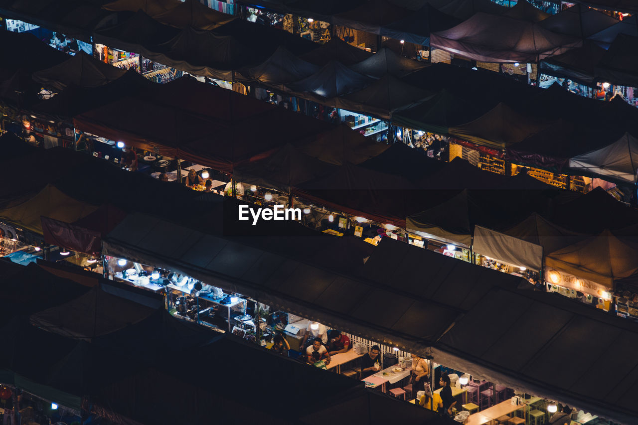 High angle view of illuminated market at night