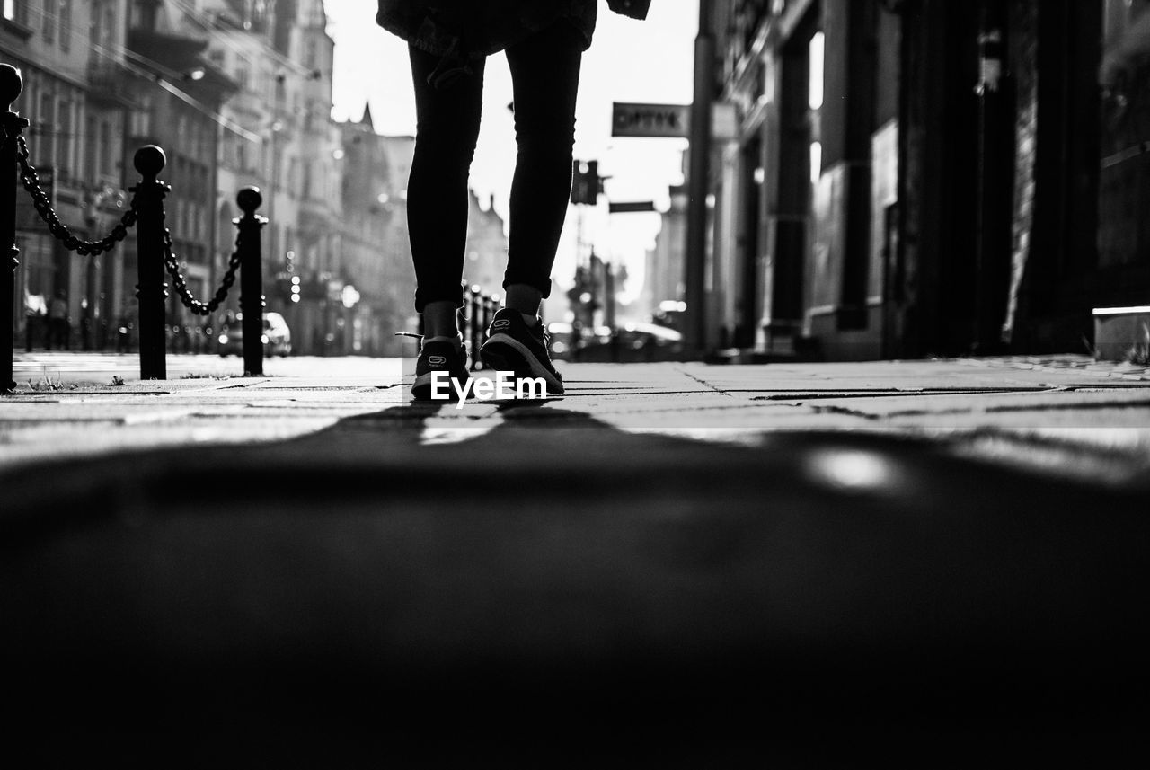 LOW SECTION OF MAN WALKING ON BICYCLE