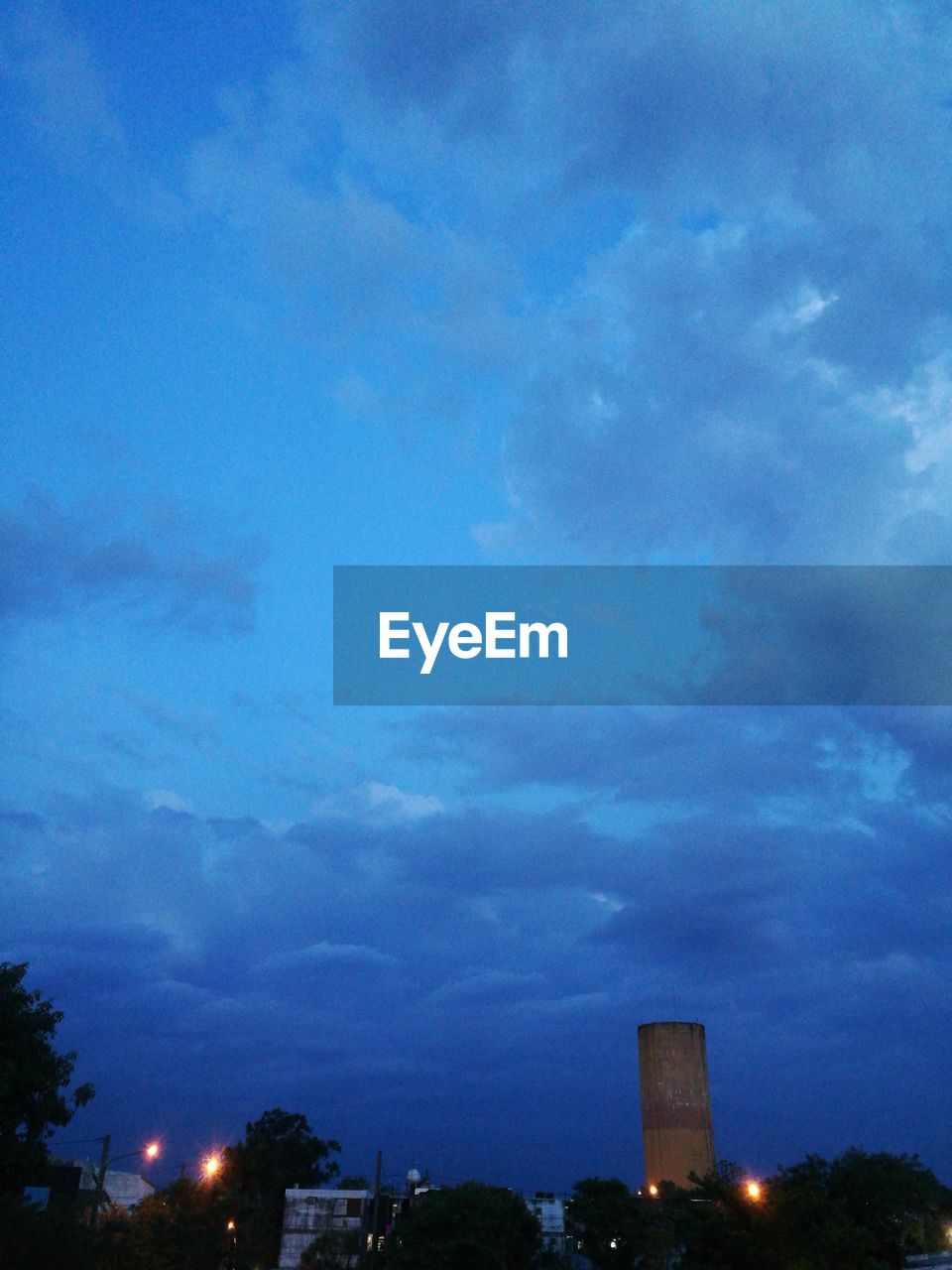 LOW ANGLE VIEW OF BLUE SKY OVER CITY