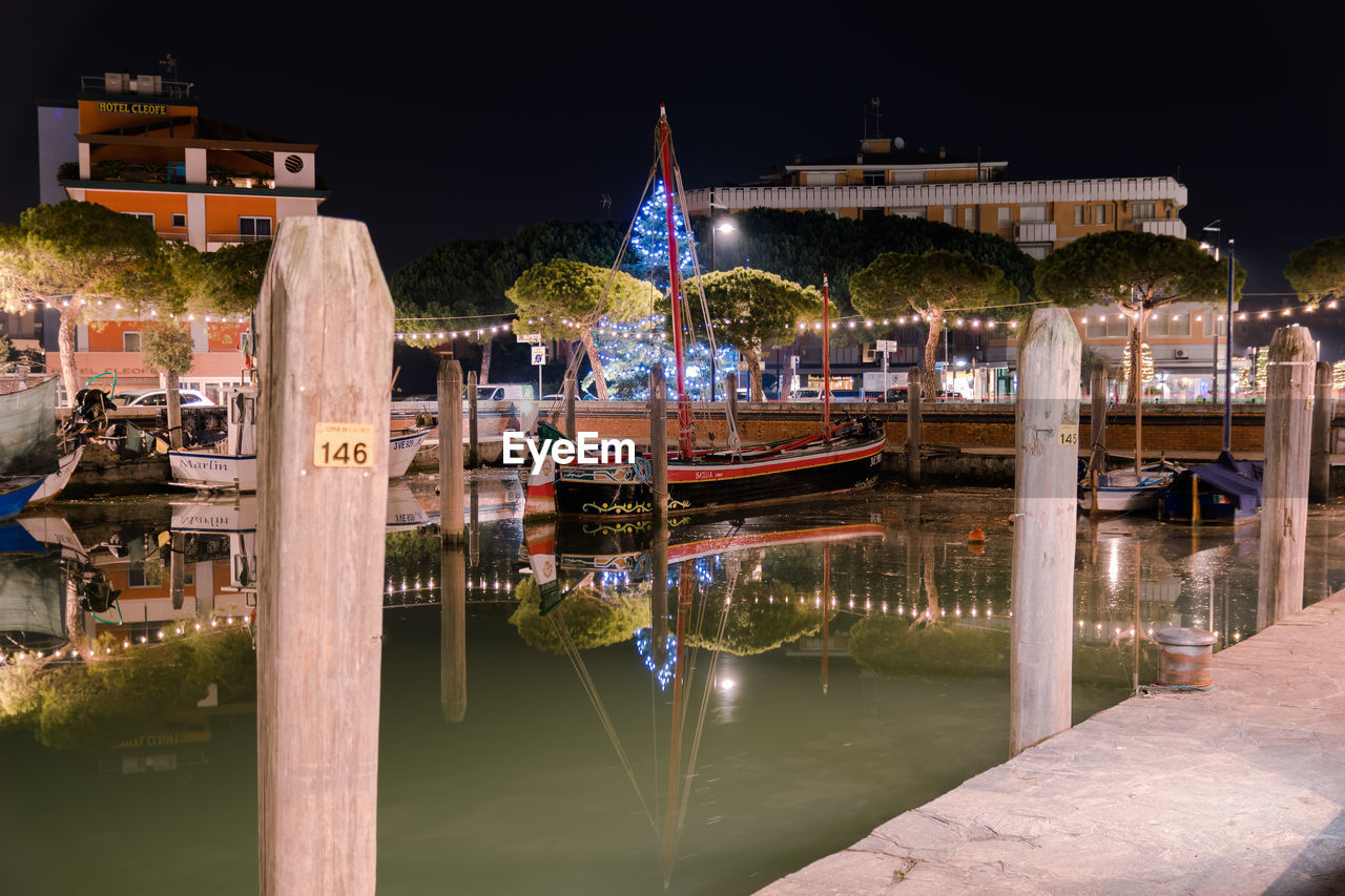 Panoramic view of illuminated bridge against sky at night