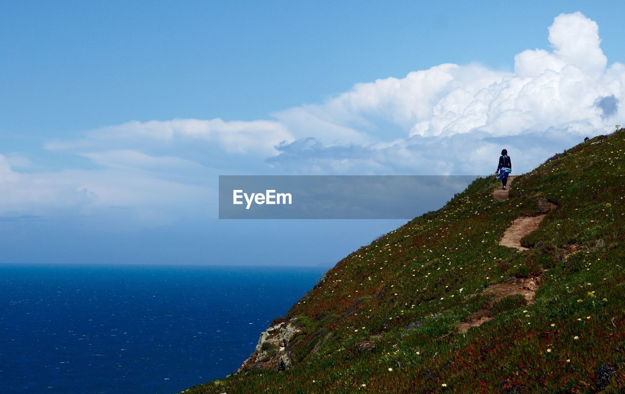 Scenic view of sea against cloudy sky