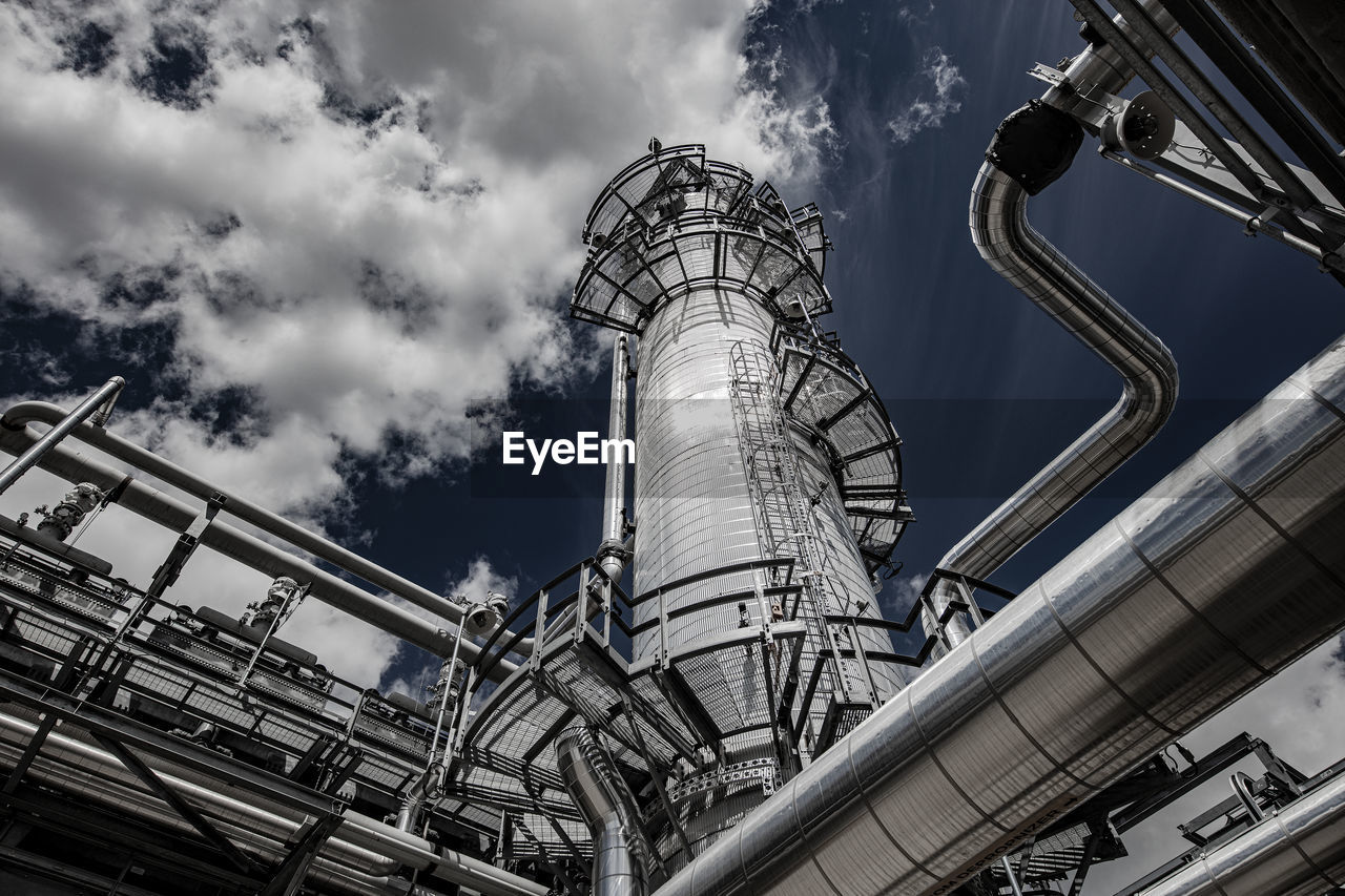 Natural gas plant structures against blue sky