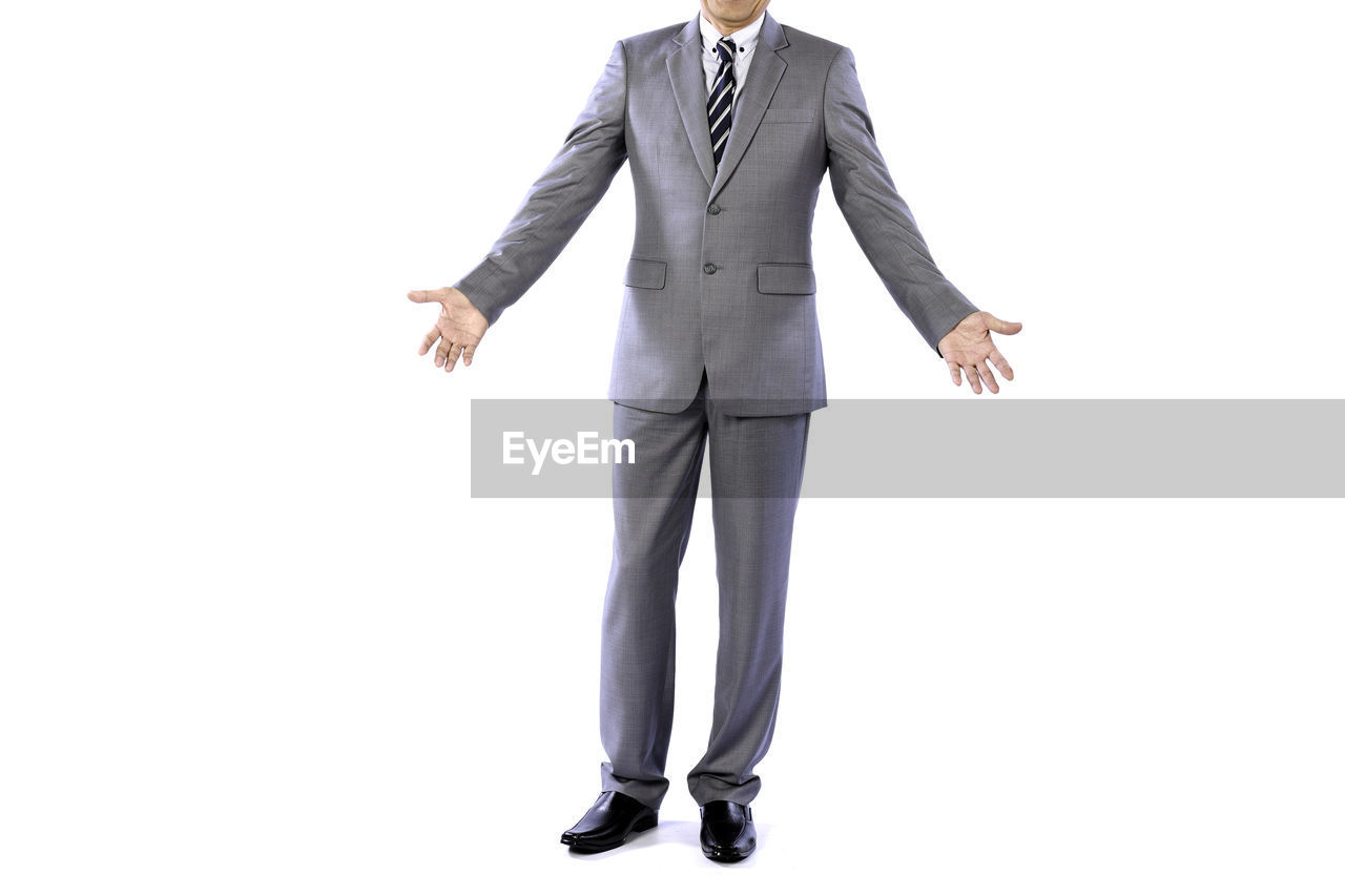 formal wear, business, businessman, adult, men, clothing, one person, tuxedo, full length, studio shot, white background, cut out, corporate business, indoors, portrait, front view, full suit, standing, copy space, white-collar worker, outerwear, business finance and industry, person, occupation, footwear, professional occupation, emotion, young adult, looking at camera, trousers