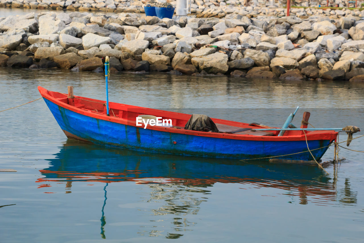 BOAT MOORED AT LAKE