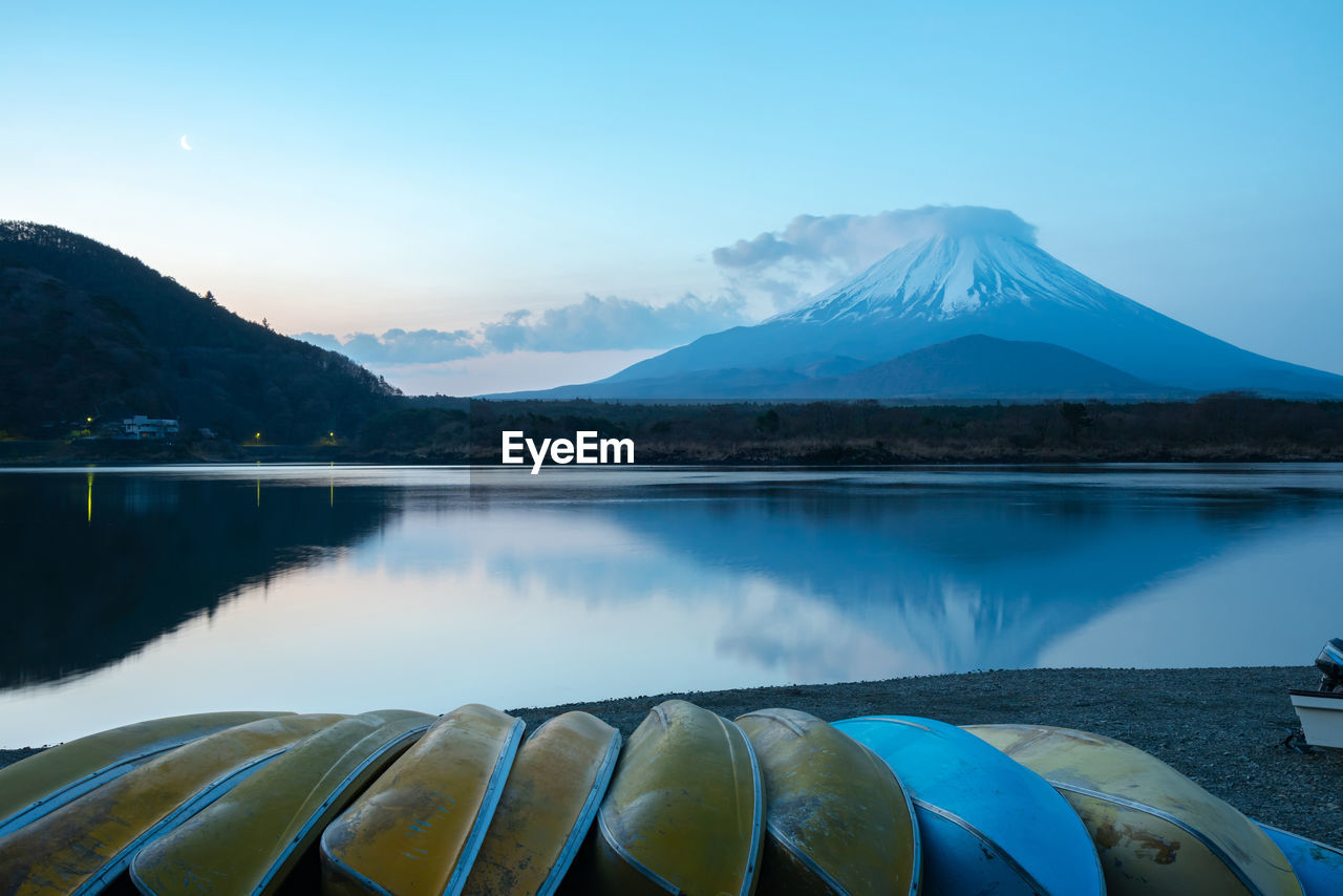 Mount fuji. view at lake shoji in the morning with row of boats. fuji five lake, yamanashi, japan.