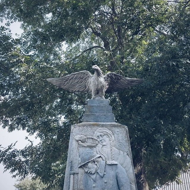 LOW ANGLE VIEW OF STATUES