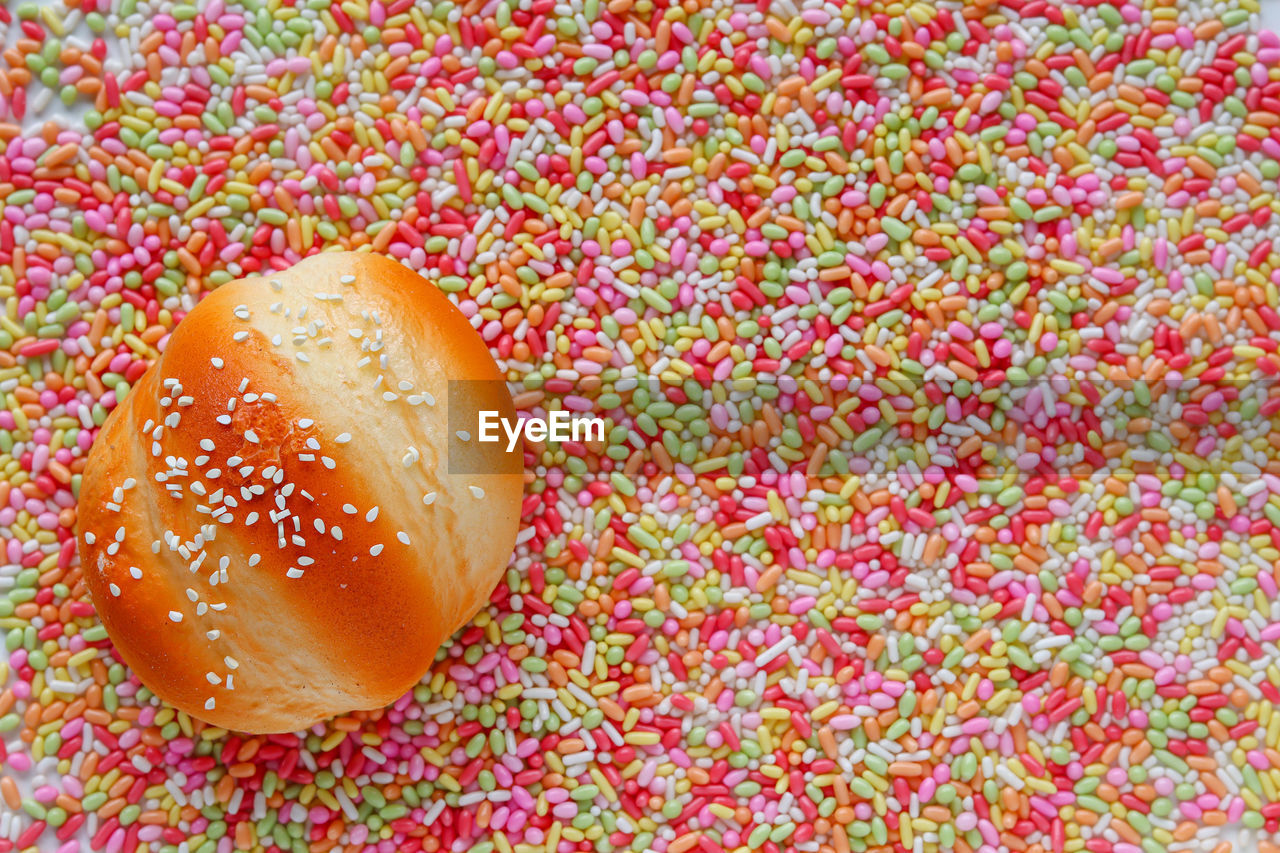 food, food and drink, fast food, freshness, no people, still life, dessert, baked, indoors, unhealthy eating, sweet food, high angle view, close-up, sweet, sprinkles, nonpareils, produce, directly above, full frame