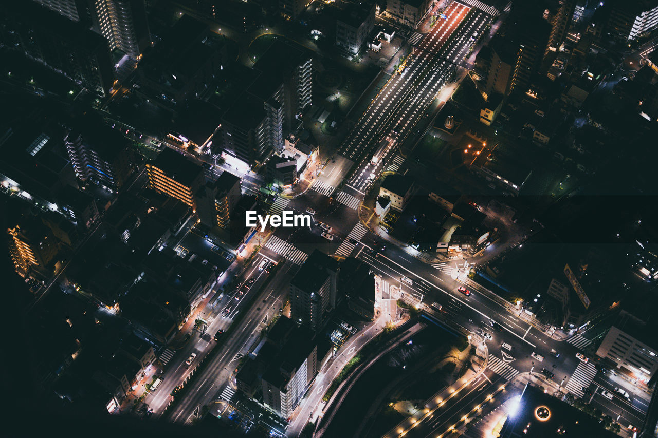 High angle view of illuminated buildings in city at night