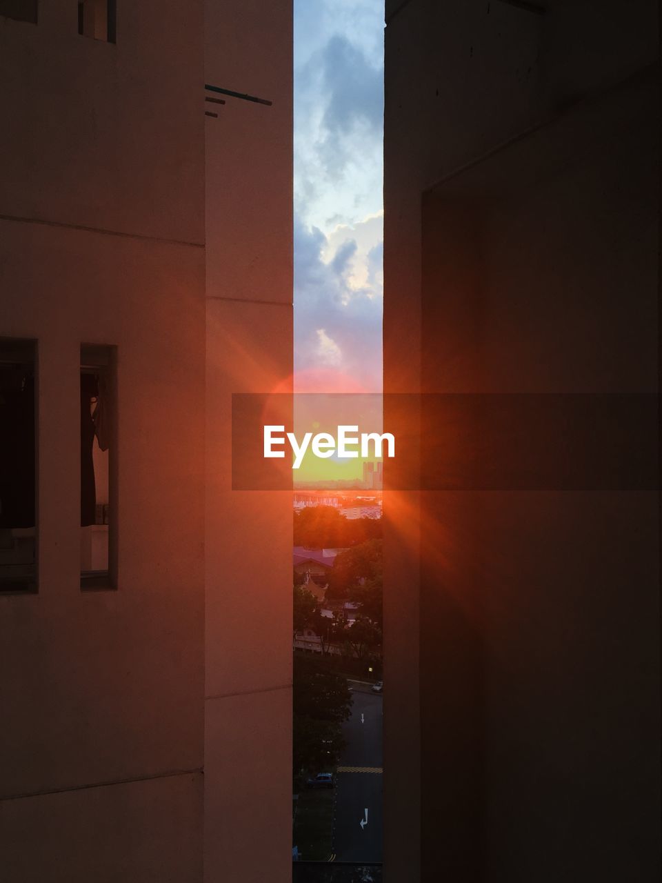 VIEW OF BUILDING AGAINST SKY DURING SUNSET