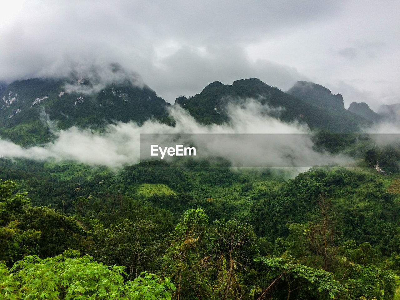 SCENIC VIEW OF MOUNTAINS AGAINST SKY DURING FOGGY WEATHER