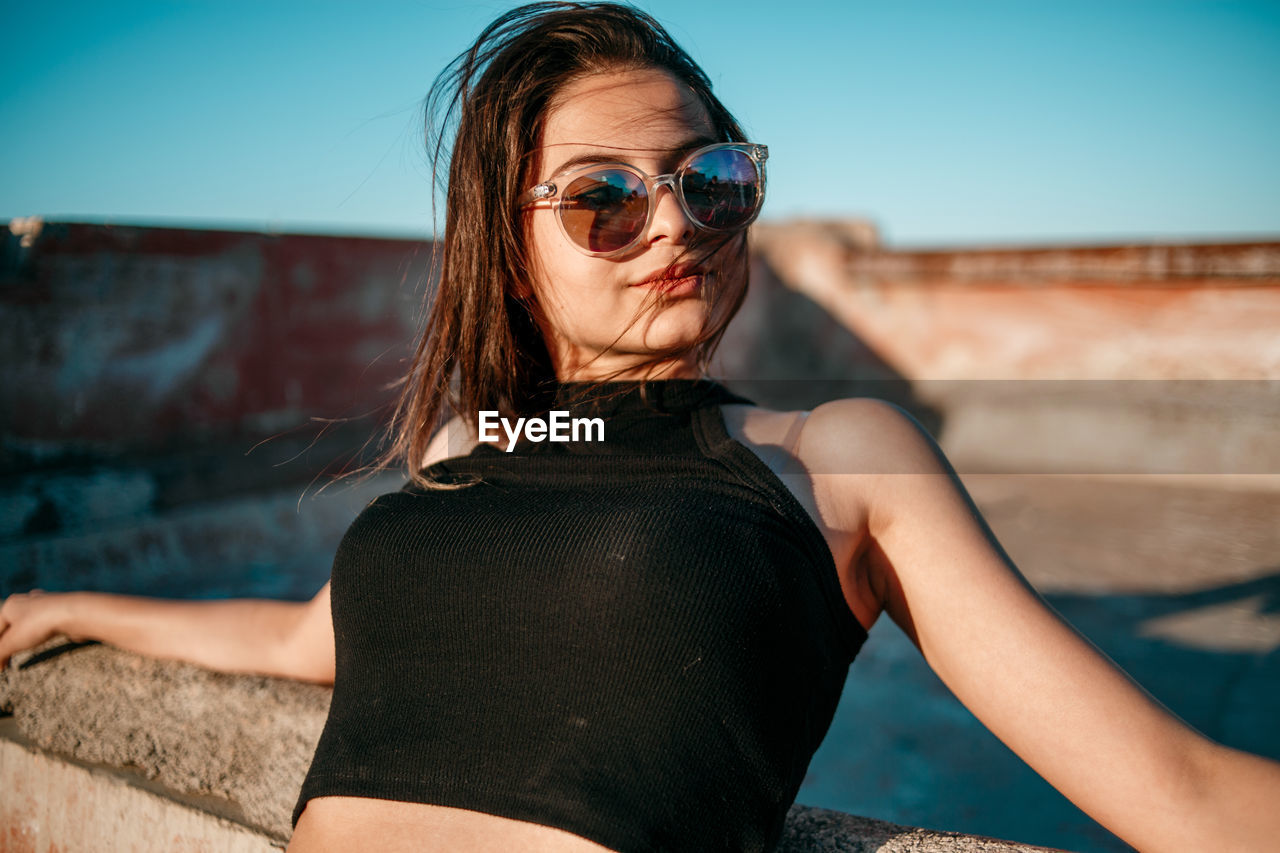 Young woman on terrace looking away