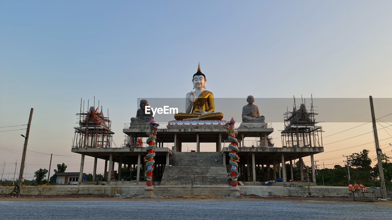 VIEW OF TEMPLE AGAINST BUILDING