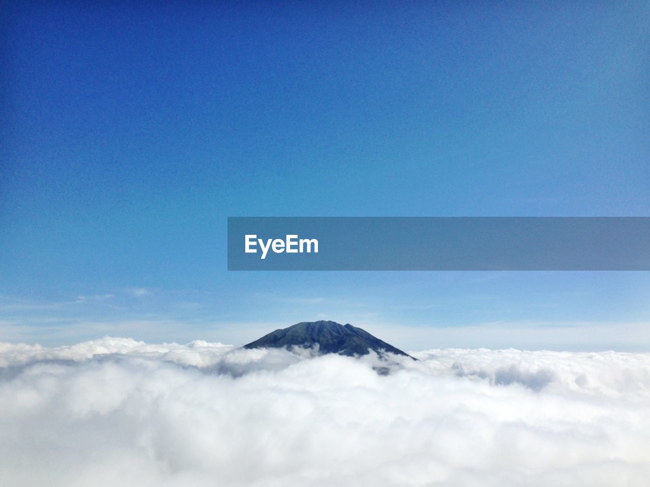Scenic view of mountain covered with clouds