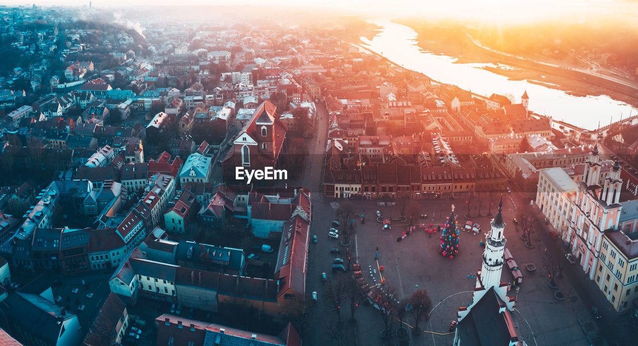 Aerial view of townscape against sky at sunset