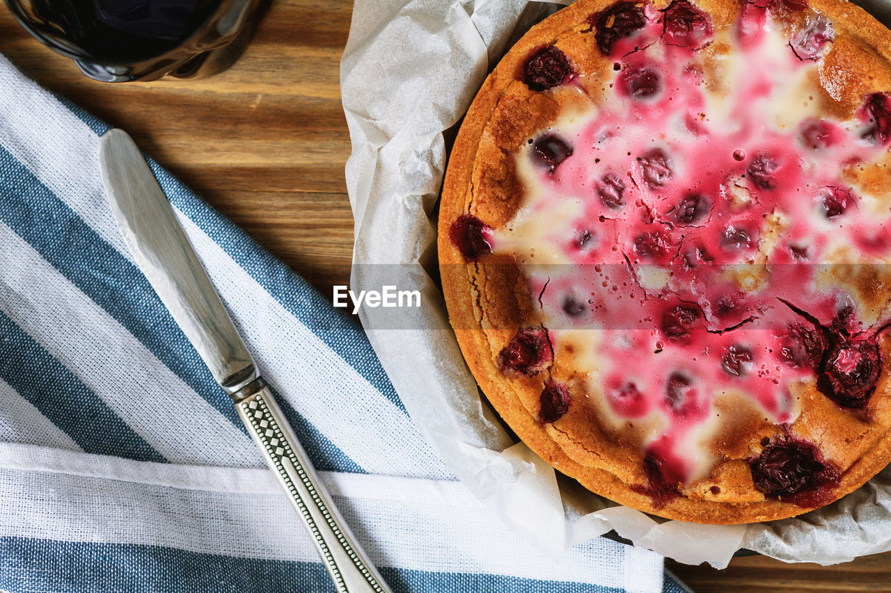 Directly above shot of tart and butter knife on table