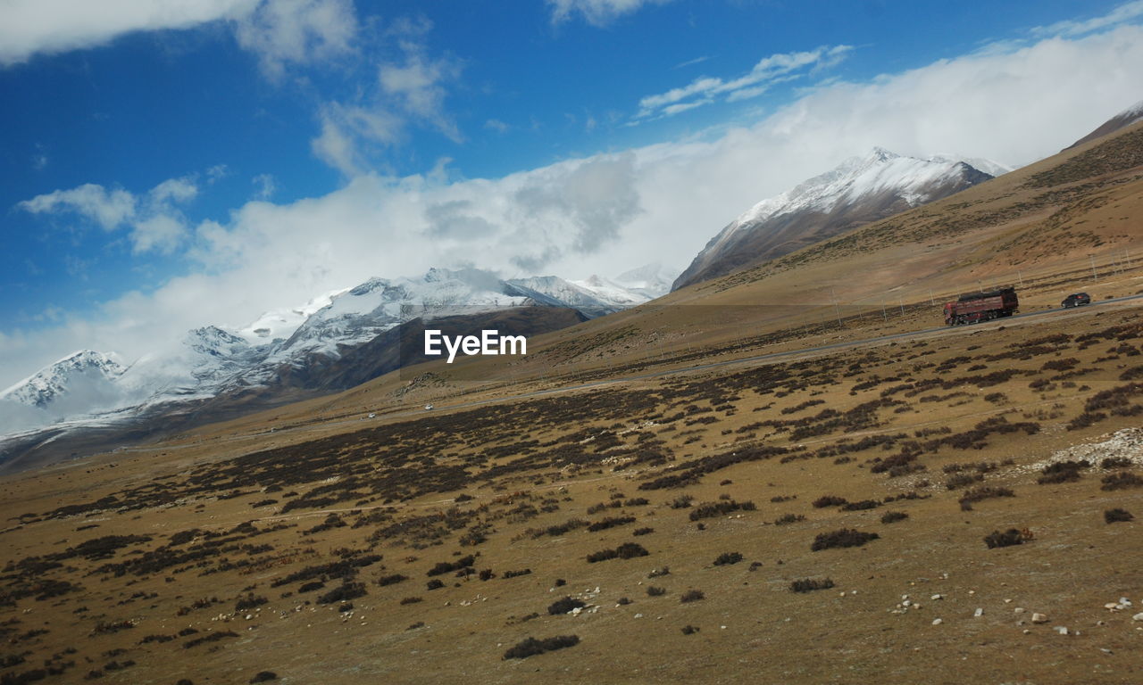 View of landscape against cloudy sky