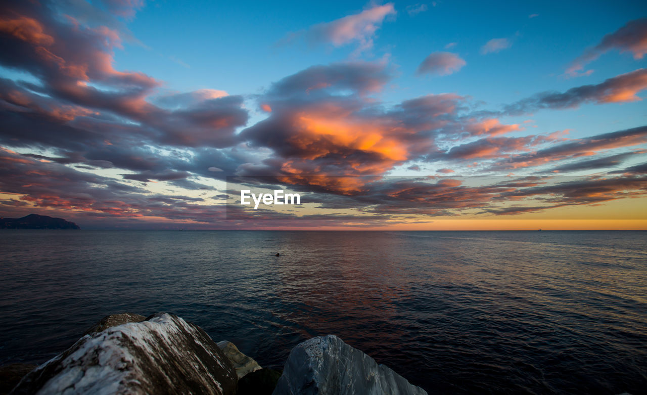 Scenic view of sea against sky during sunset