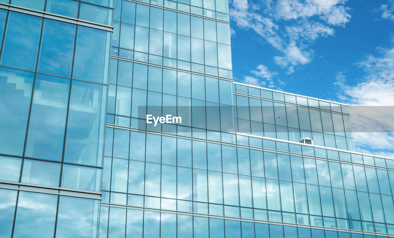 Modern sustainable glass office building. exterior view of corporate headquarters glass building