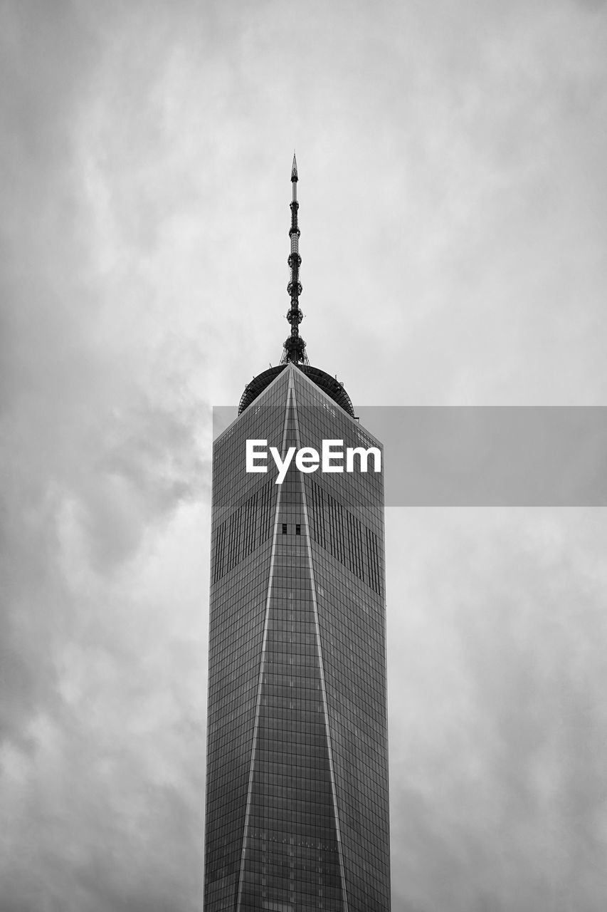 Low angle view of building against cloudy sky world trade one