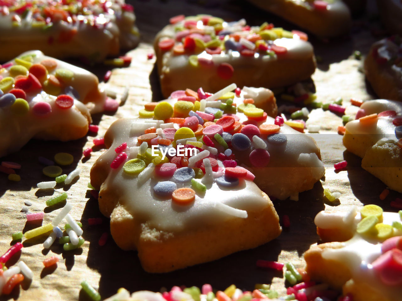 High angle view of unicorn shaped cookie with sprinkles