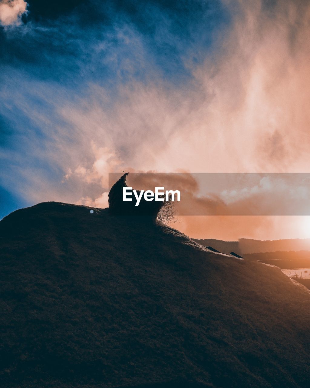 Low angle view of mountain against sky during sunset