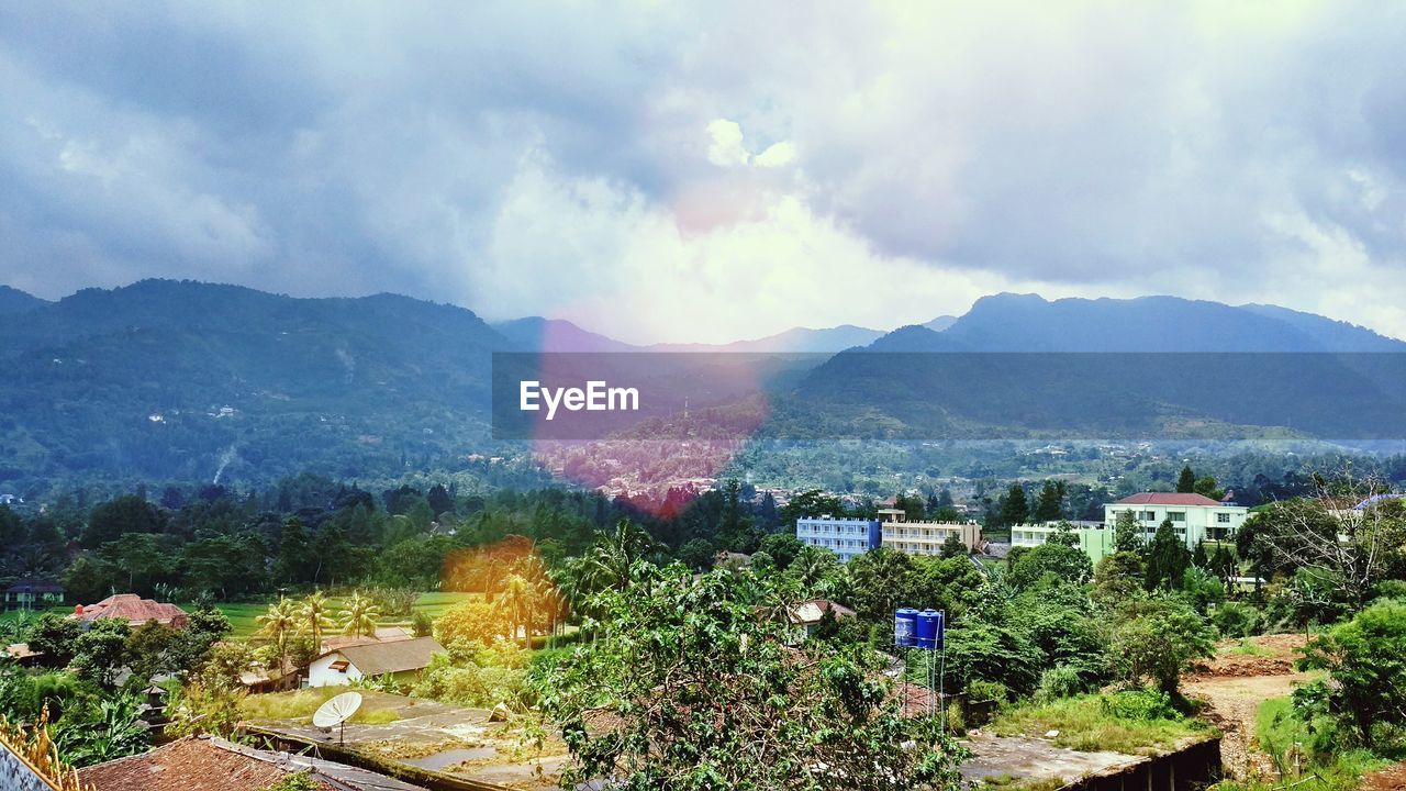 Scenic view of mountains against cloudy sky