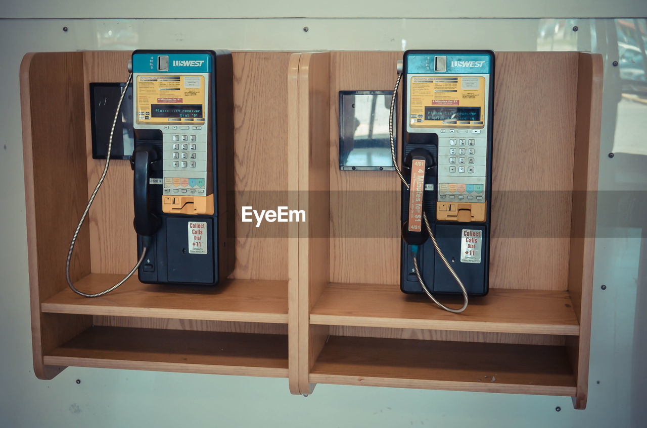 CLOSE-UP OF TELEPHONE BOOTH ON SHELF