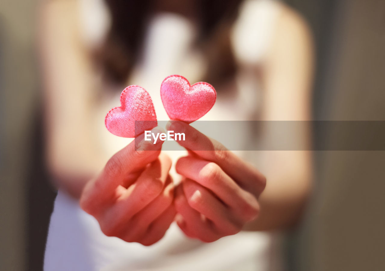 Close-up of woman hand holding heart
