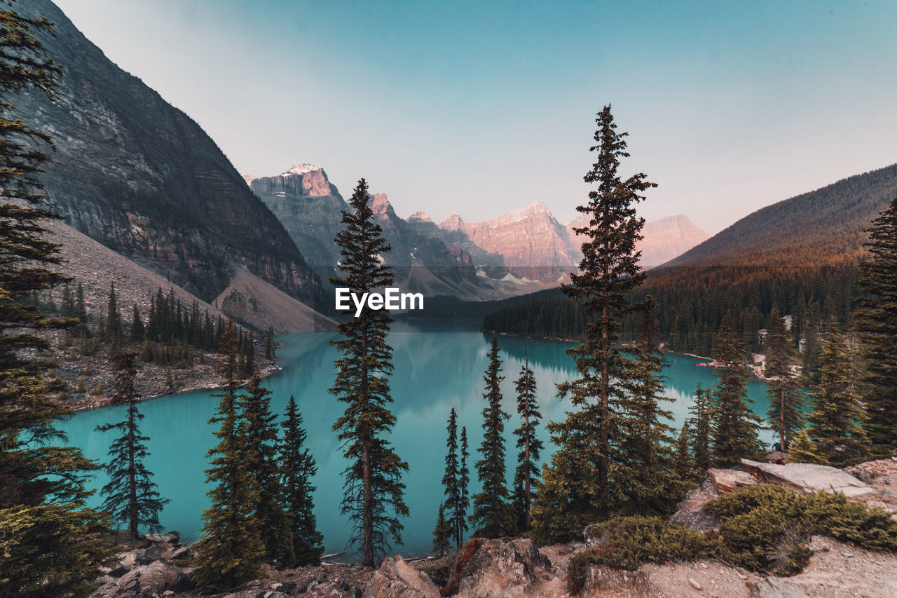 Scenic view of lake and mountains against sky