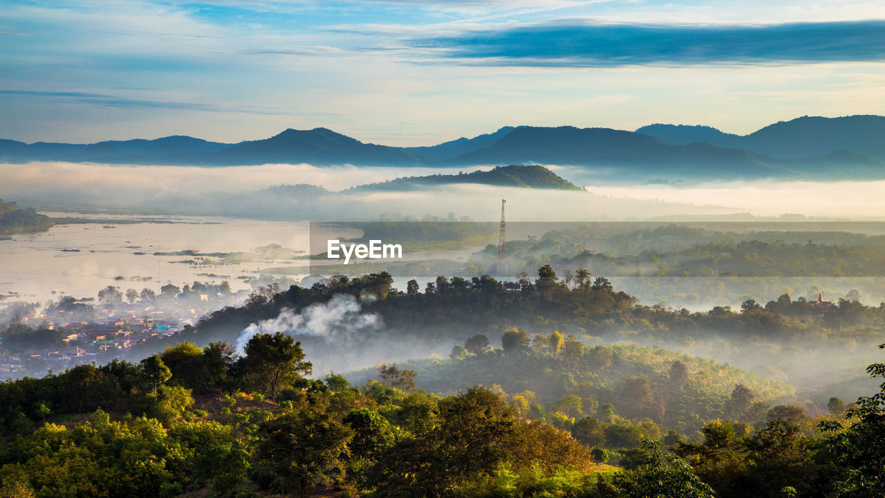 Scenic view of mountains against sky at sunset