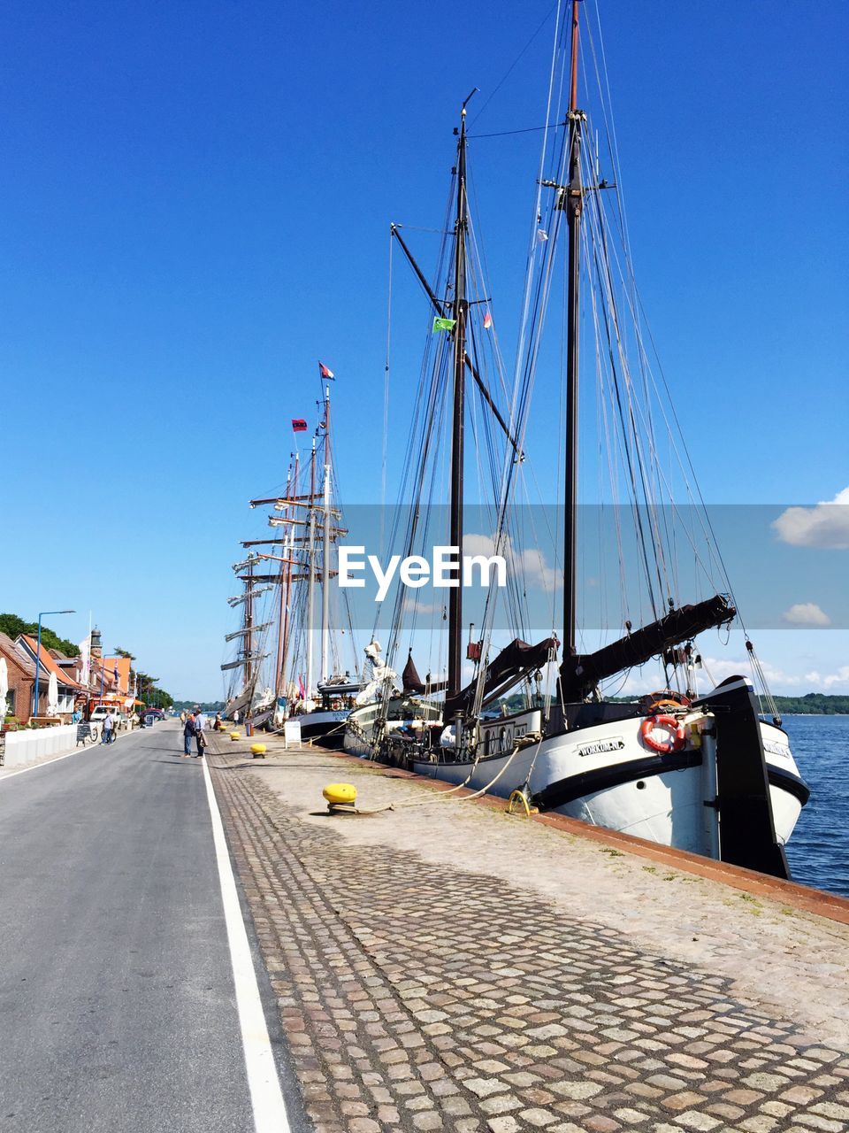 VIEW OF HARBOR AGAINST BLUE SKY AND CLOUDS