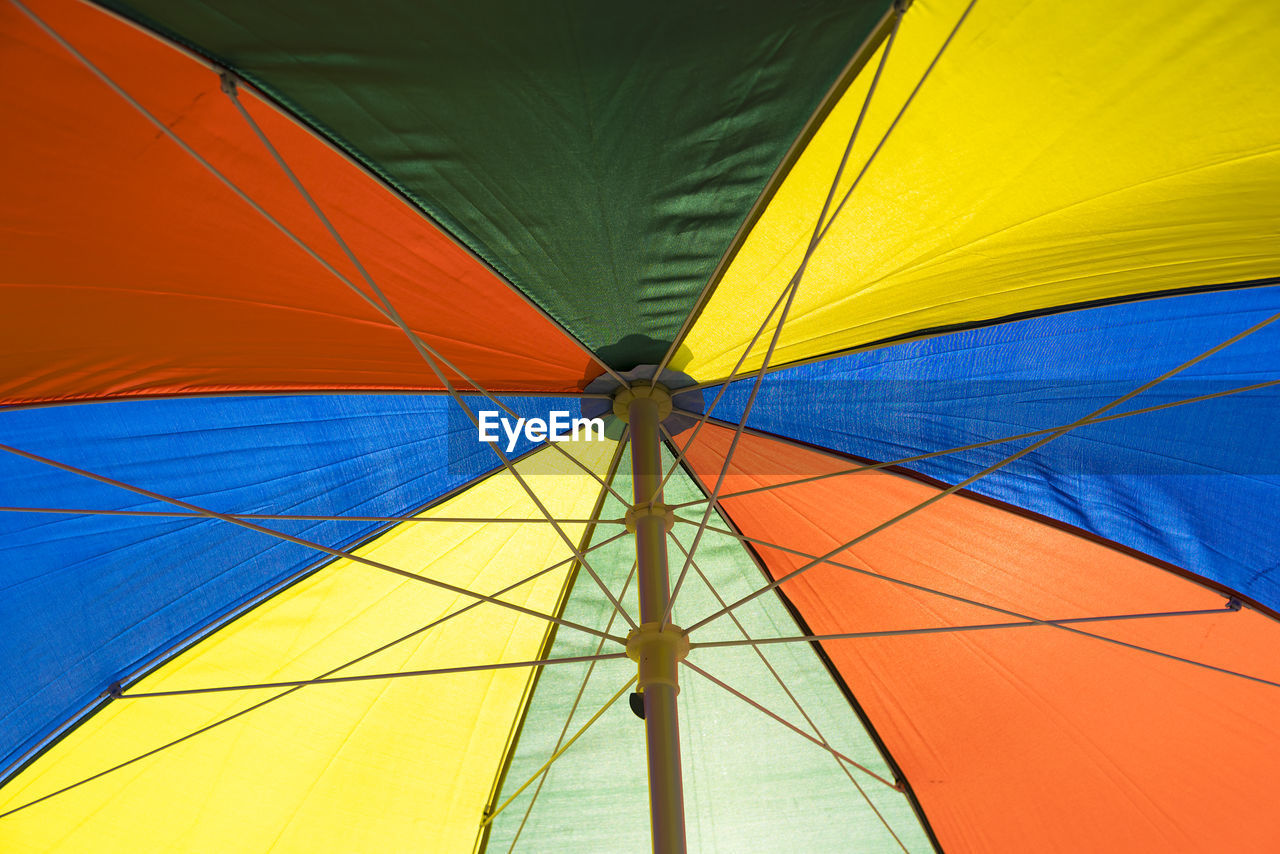 Low angle view of colorful umbrella