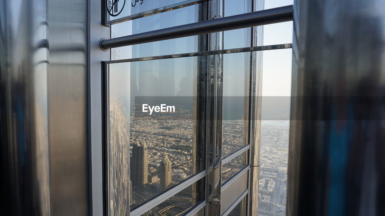 BUILDINGS SEEN THROUGH WINDOW