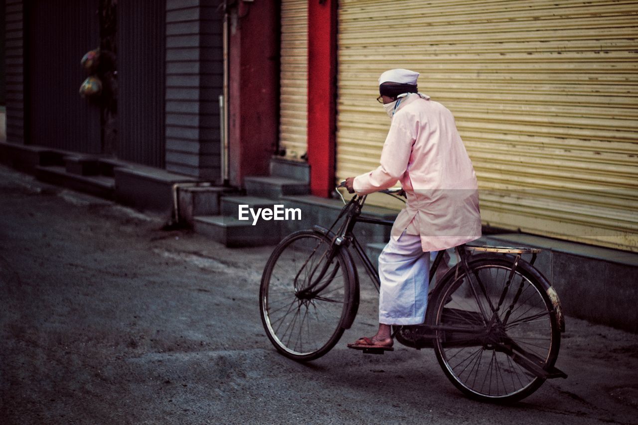 Man riding bicycle on street