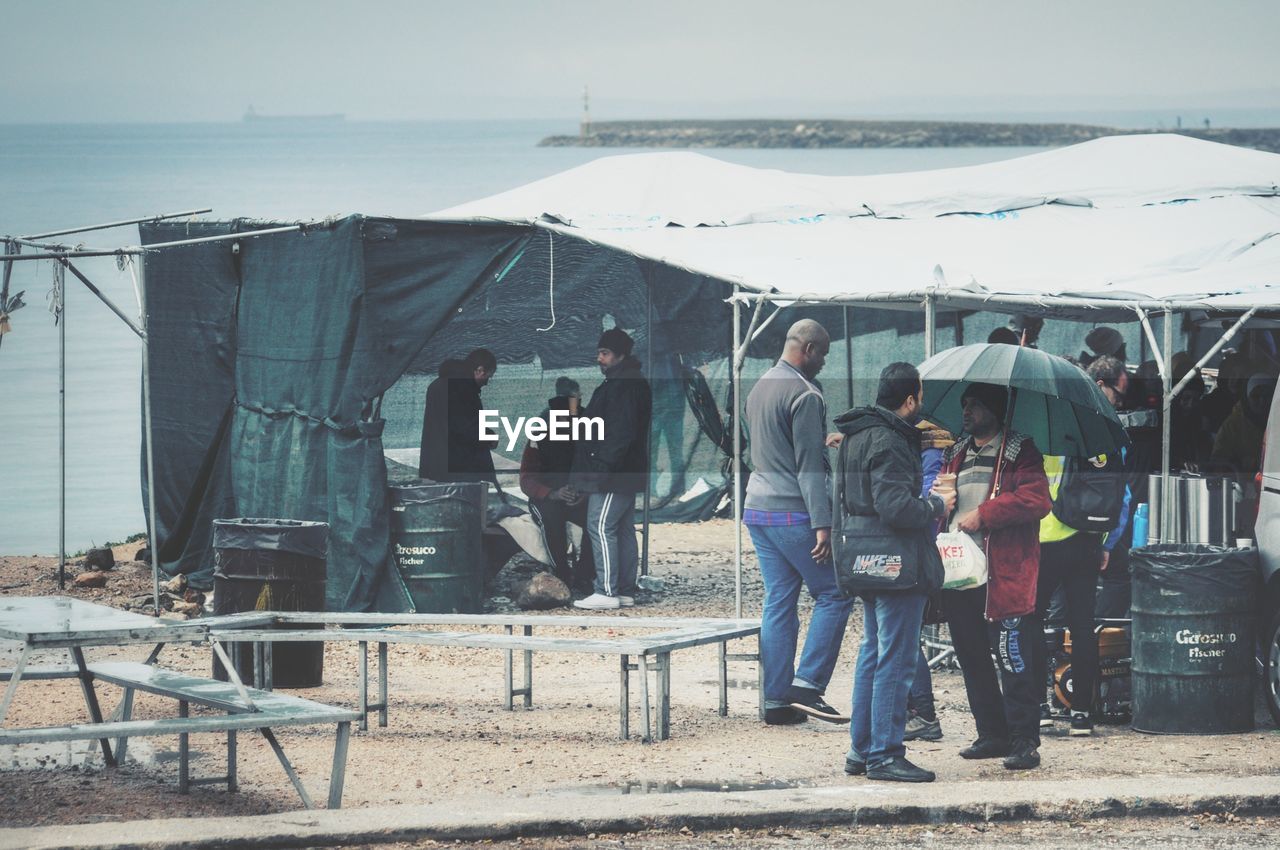 PANORAMIC VIEW OF PEOPLE ON SEA