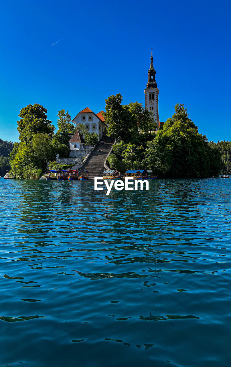 Scenic view of the church on the island of bled lake with a perfectly blue sky