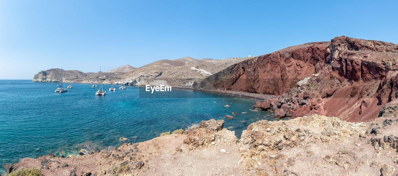 Scenic view of sea against clear blue sky