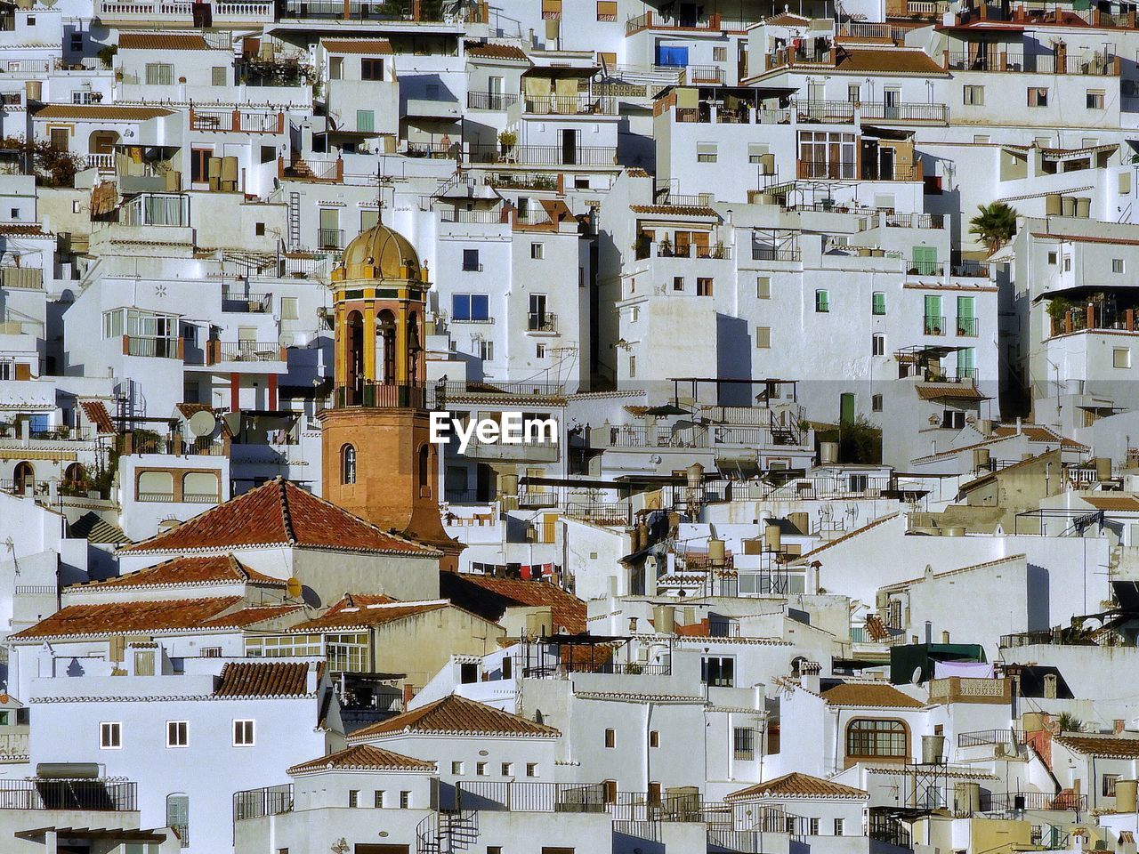 View of the houses and church of compete, a white village in spain