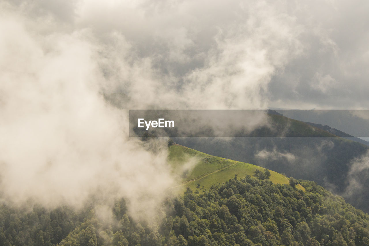 Tusheti mountain landscape and view, high angle, georgian nature, clouds and forest