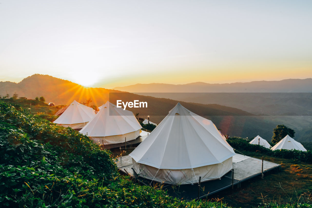 View of tents against sky during sunset