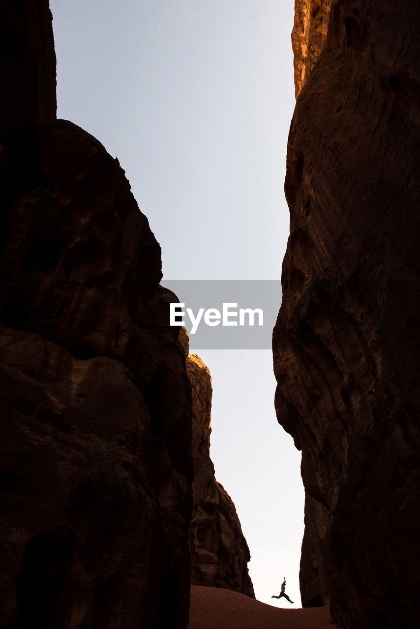 Low angle view of rock formations against sky