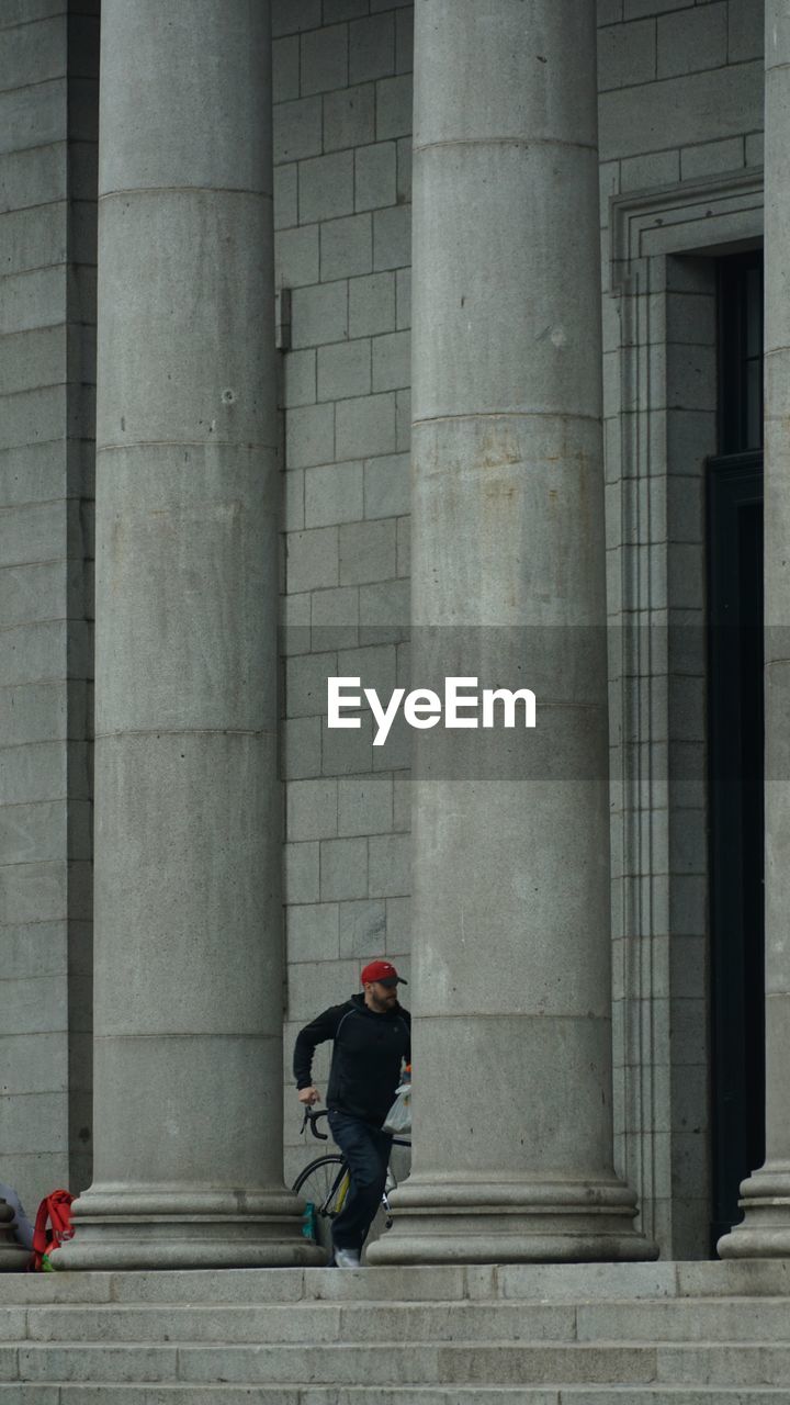 Rear view of woman walking in building