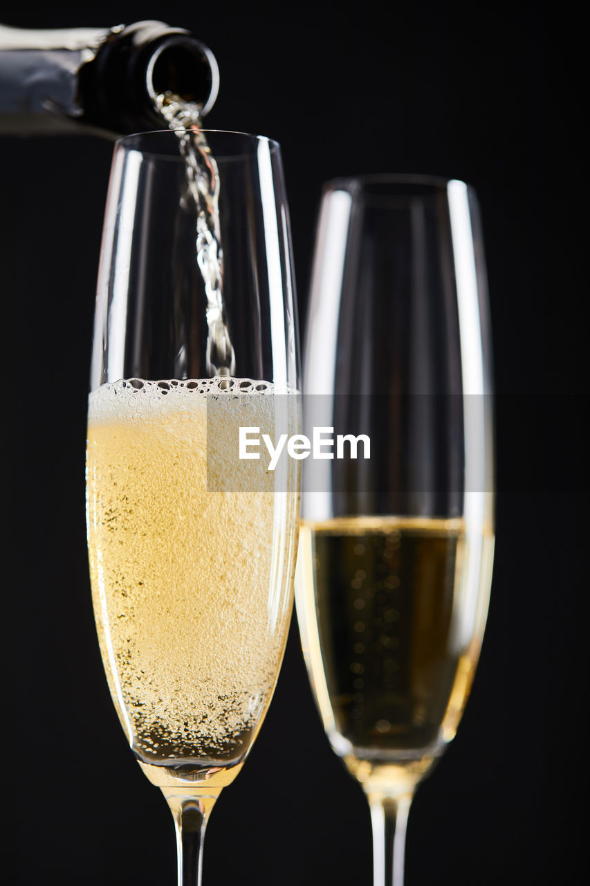 close-up of drink in glass against black background