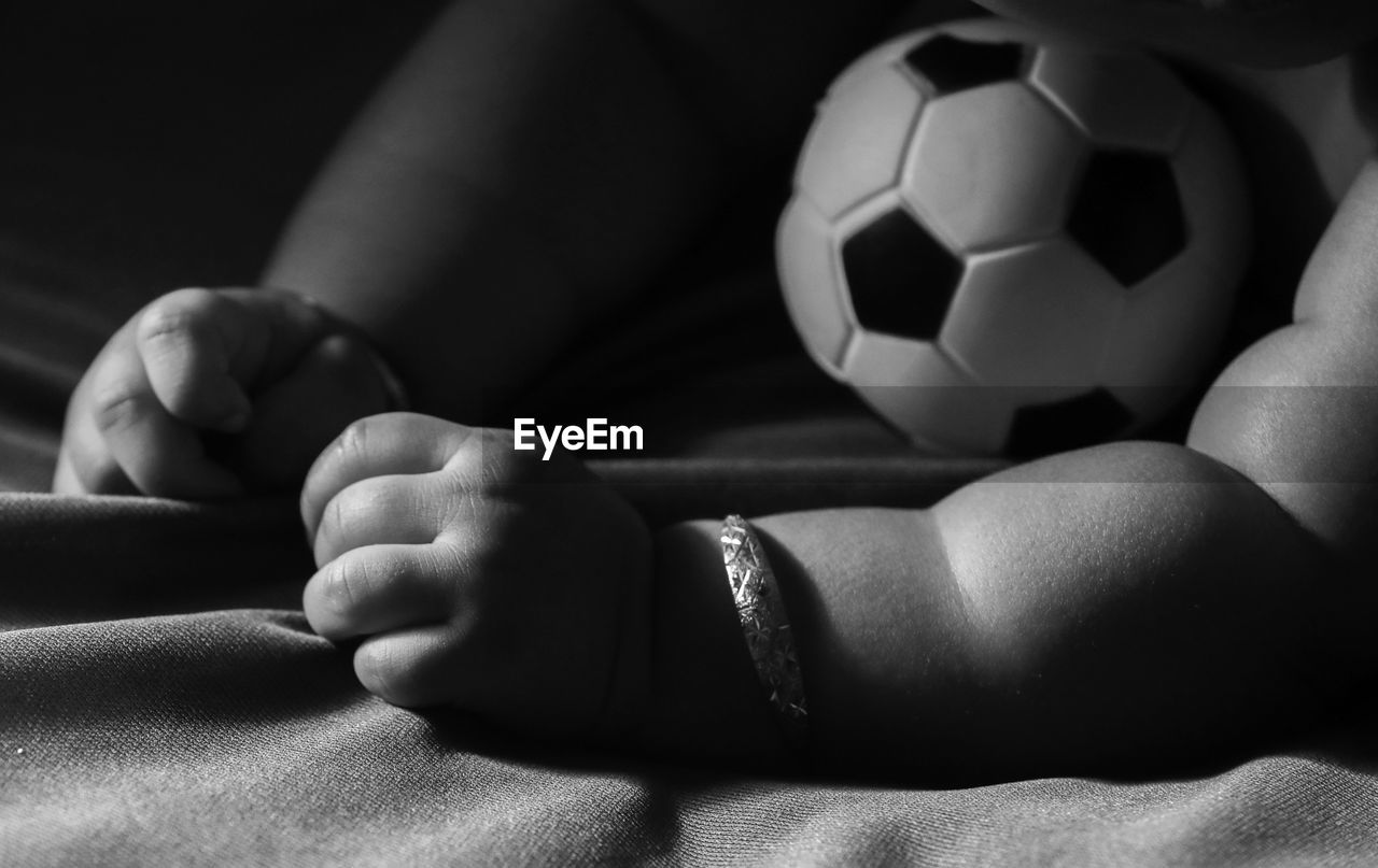Close-up of baby with soccer ball