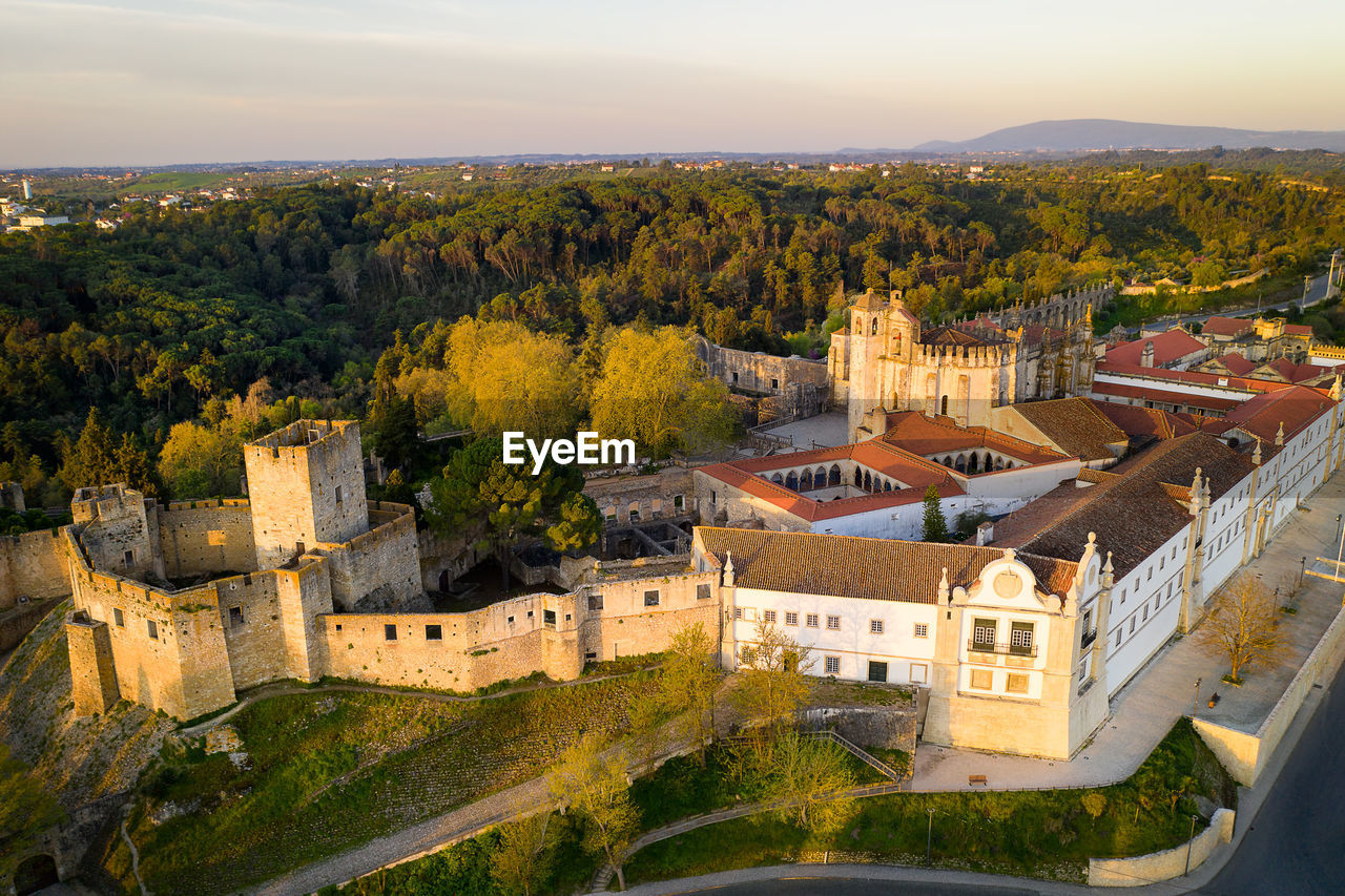 Aerial drone view of convento de cristo christ convent in tomar at sunrise, portugal